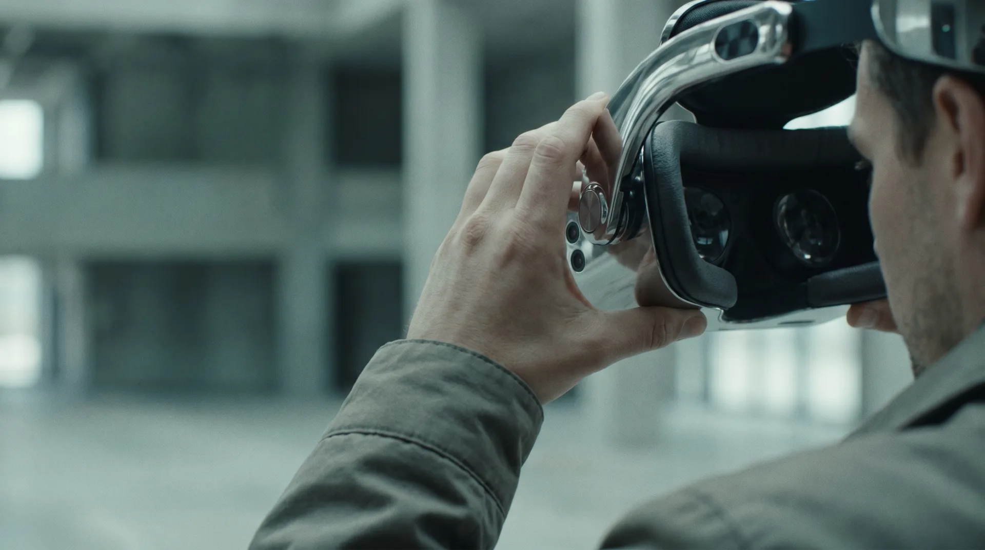 Close-up of hands adjusting a silver 6DoF VR headset